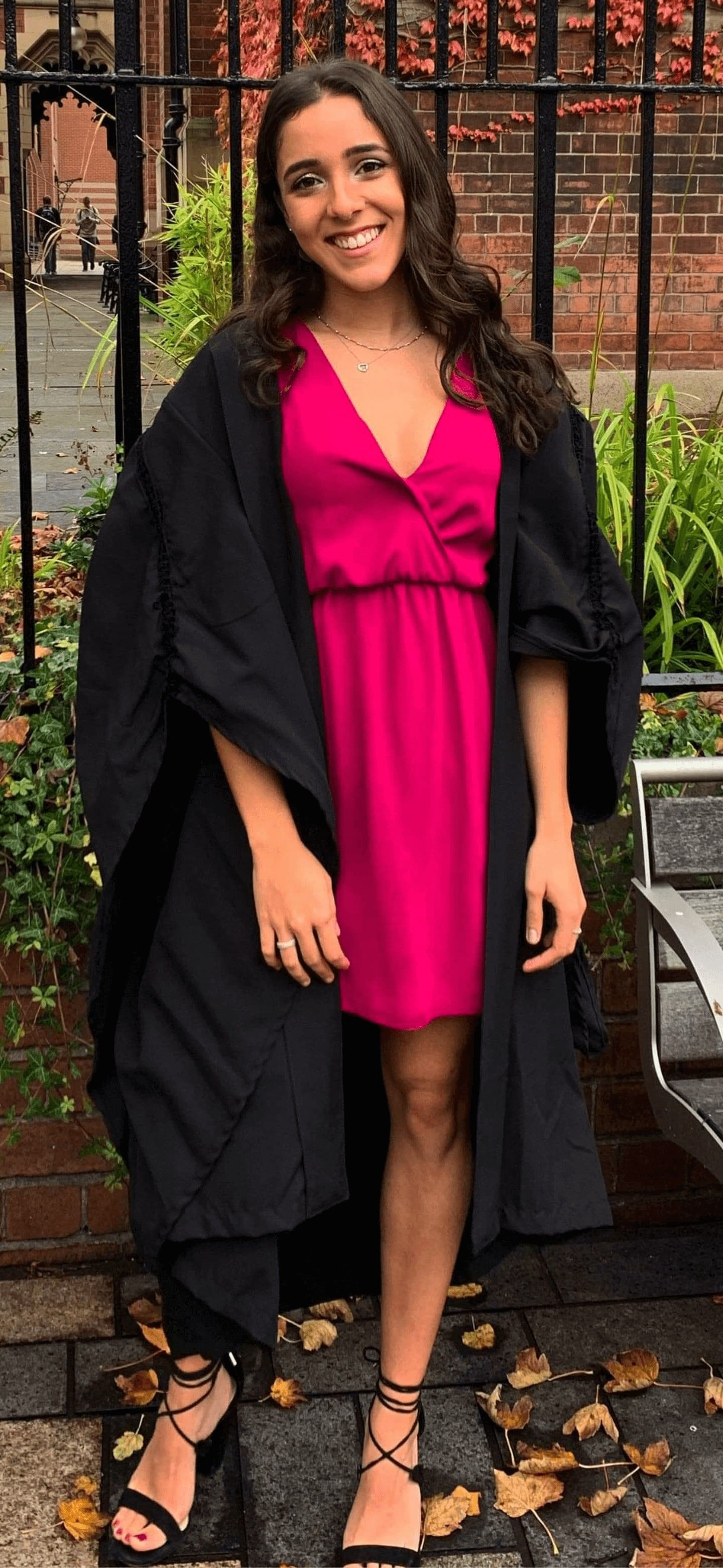 Image may contain: Graduation, Plant, Coat, Overcoat, Woman, Female, Fashion, Dress, Human, Person, Apparel, Clothing