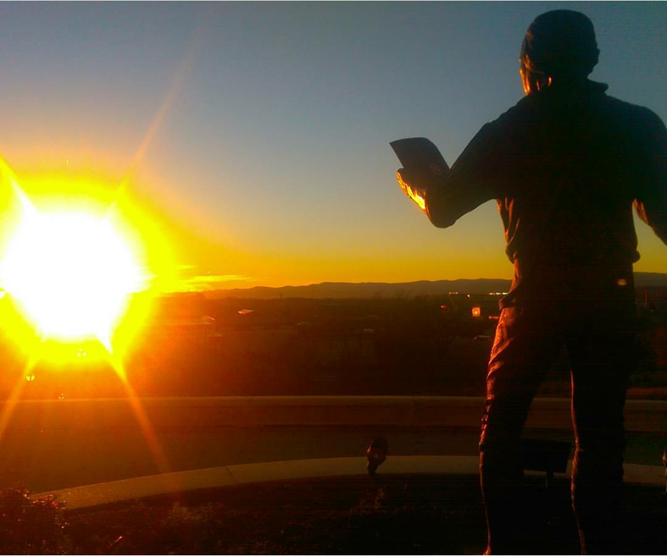A sunset photo of the ISAT James Madison statue.
