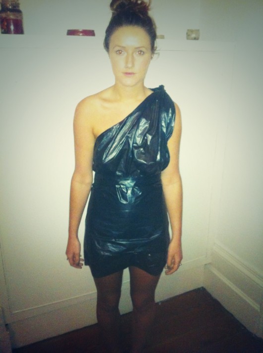 Step two: take another bin bag and unfold it, flattened out, then tape it around to create shape