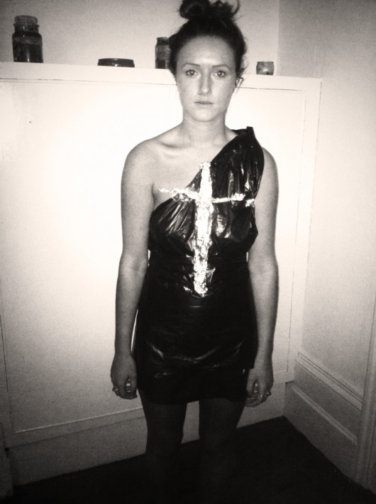 Step five: Tap to strips of tinfoil to your chest in a cross shape