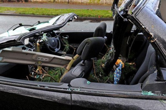A car is damaged due to earlier winds