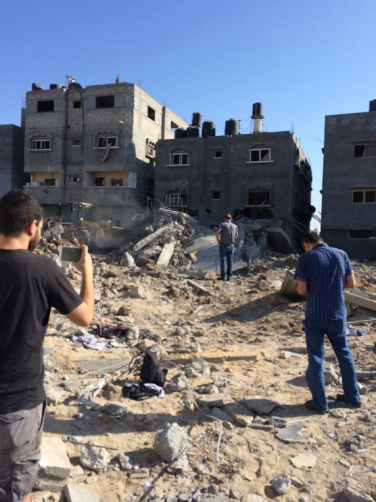 Bulldozers are used to transport dead bodies from the area