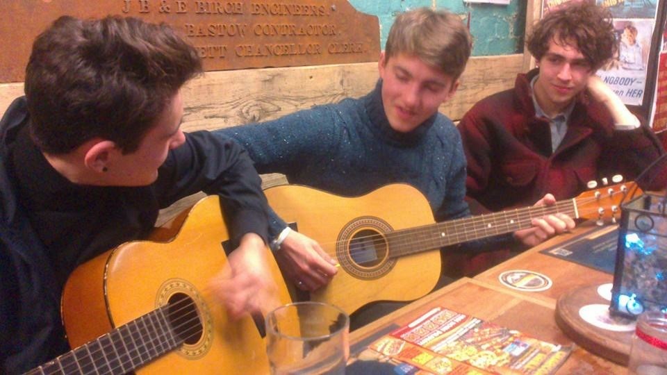 The place where playing guitars in small pubs is standard