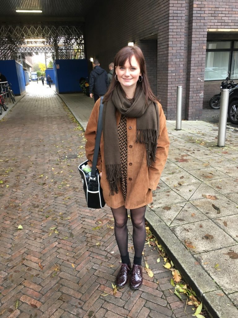 Edgy Emma takes making the winter look cool to a whole new level. The brown, suede jacket and patent brogues immediately draw attention to her indie vibes, enhanced by a glimpse of her quirky, patterned dress. Emma knows how to do winter in style.