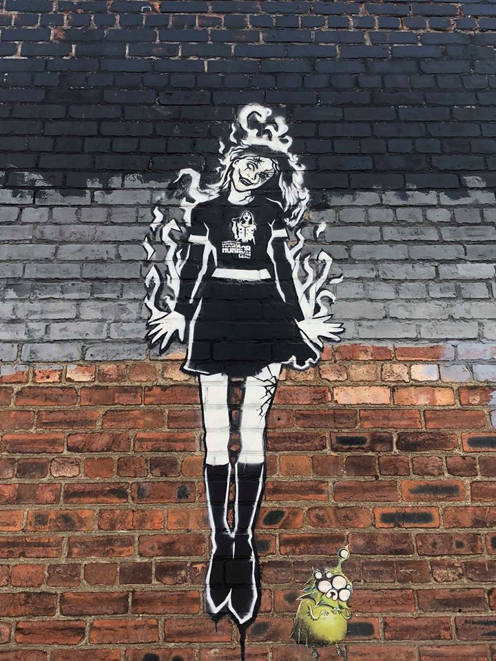 Image may contain: Brick, Graffiti, Person, People, Human
