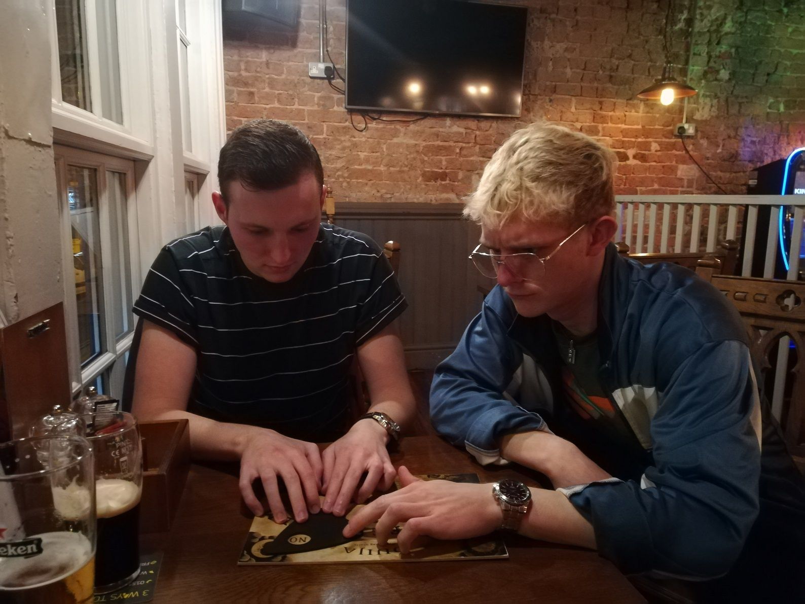 Image may contain: Pub, Brick, Person, People, Human