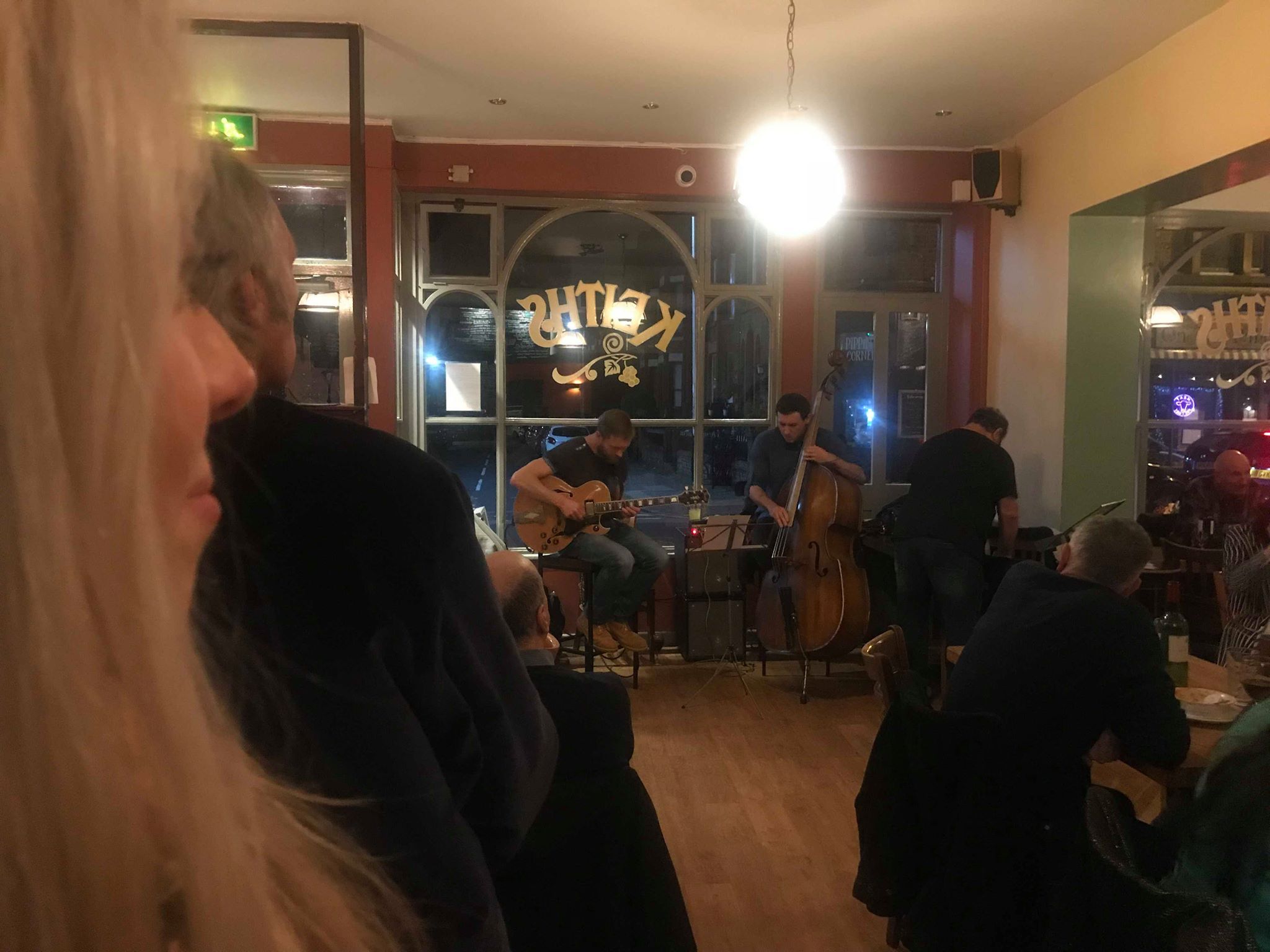 Image may contain: Restaurant, Meal, Food, Diner, Performer, Musician, Musical Instrument, Music, Leisure Activities, Guitarist, Guitar, Furniture, Couch, Person, People, Human