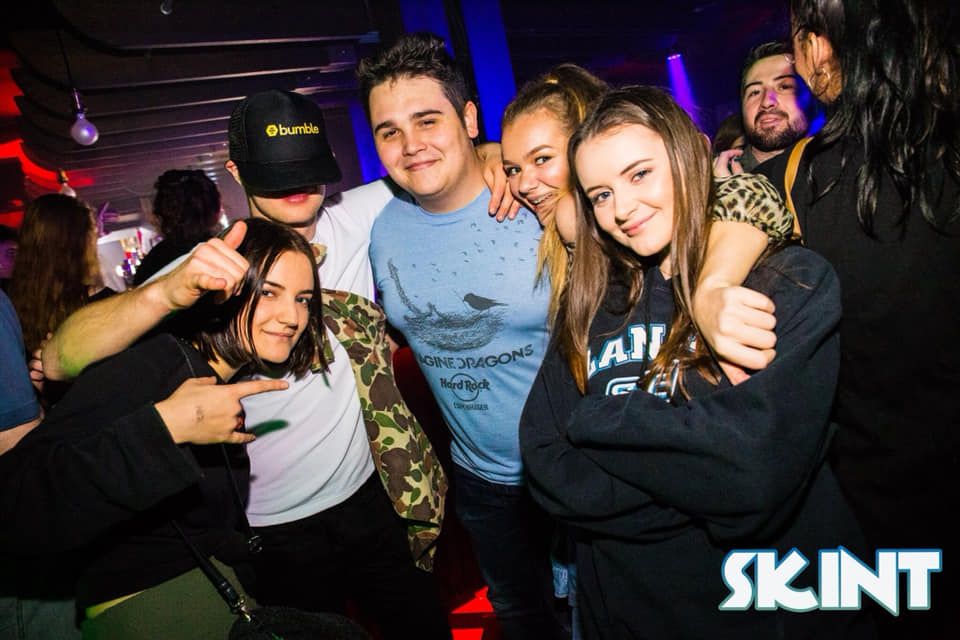 Image may contain: Night Club, Clothing, Apparel, Hat, Club, Party, Human, Person