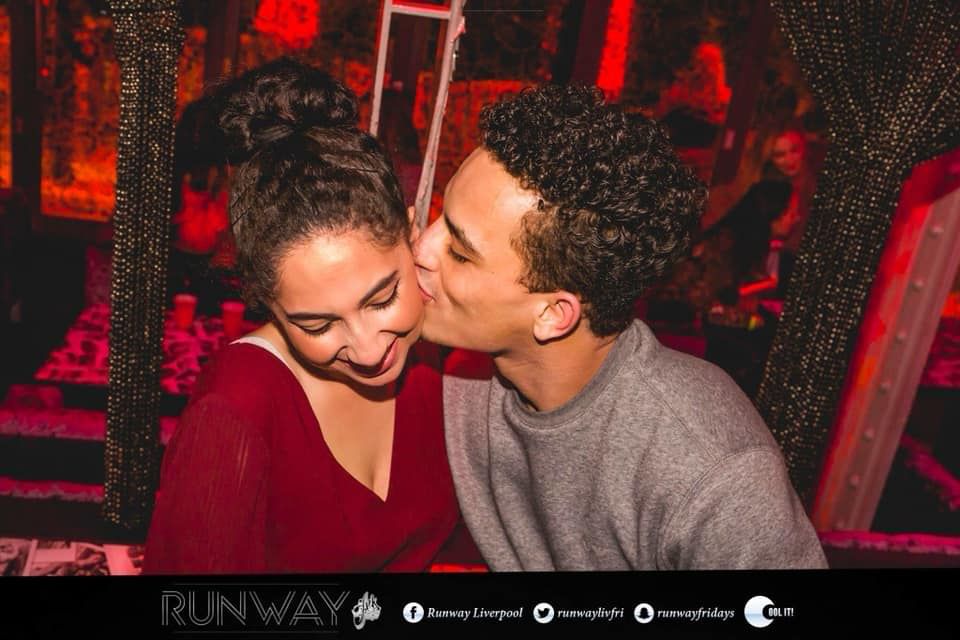 Image may contain: Night Life, Hug, Face, Night Club, Kiss, Kissing, Club, Make Out, Dating, Human, Person