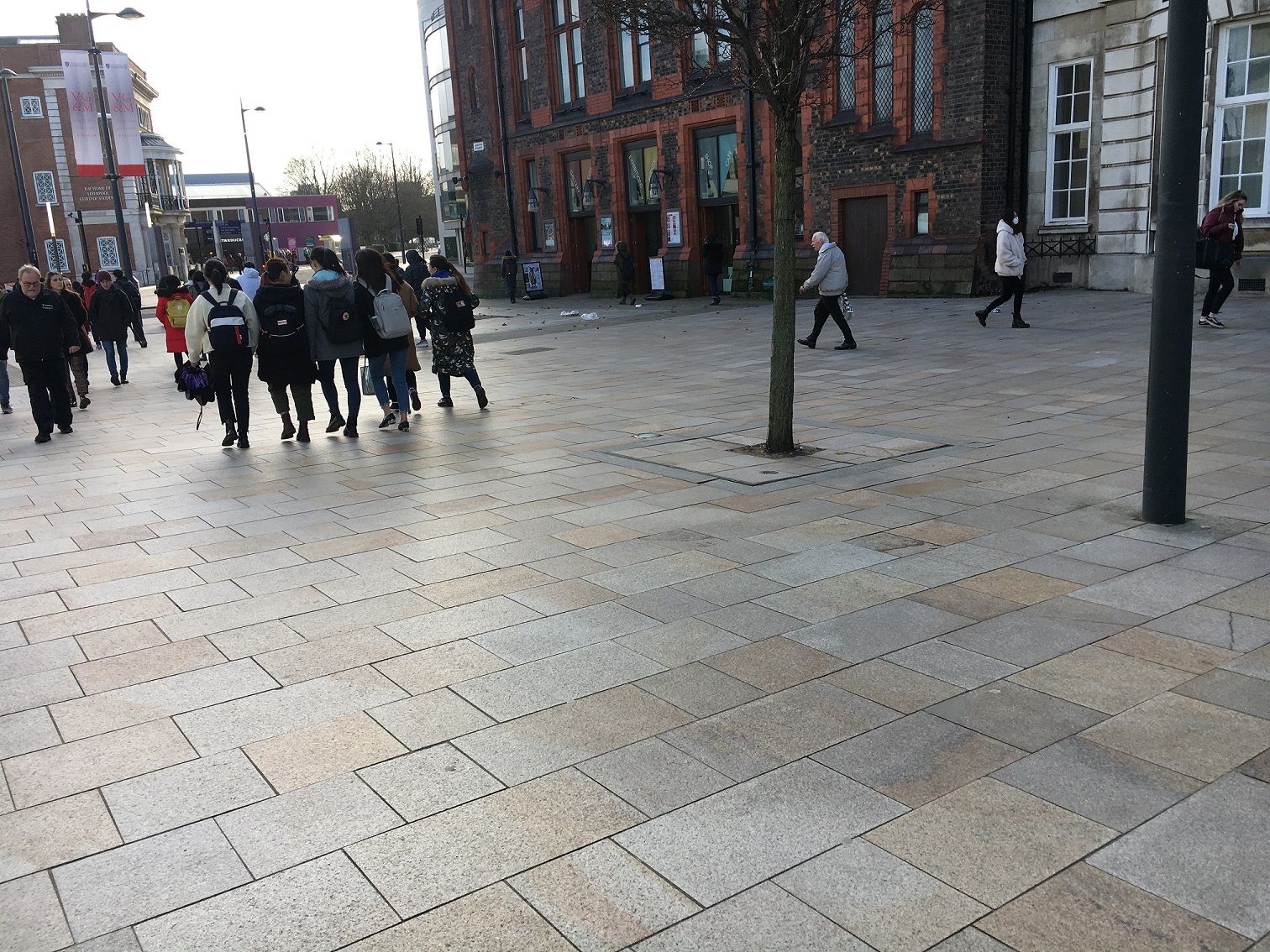 Image may contain: Plaza, Town Square, Road, Metropolis, Pavement, Sidewalk, Walkway, Flooring, Floor, Architecture, Path, Flagstone, Town, Urban, Downtown, City, Building, Pedestrian, Human, Person