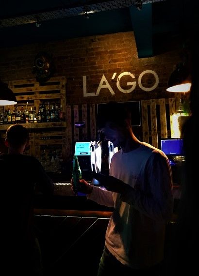 Image may contain: Bartender, Worker, Lighting, Bar Counter, Pub, Person, Human
