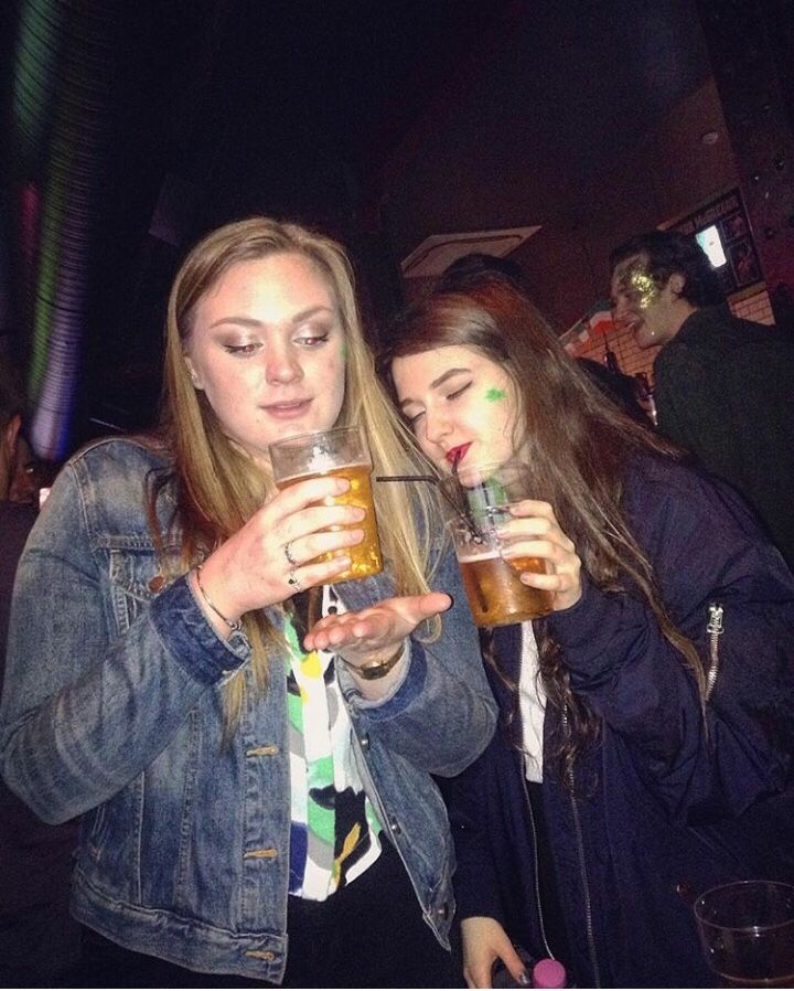 Image may contain: Face, Pants, Female, Night Club, Drinking, Lager, Beer, Club, Clothing, Apparel, Alcohol, Drink, Beverage, Party, Person, Human