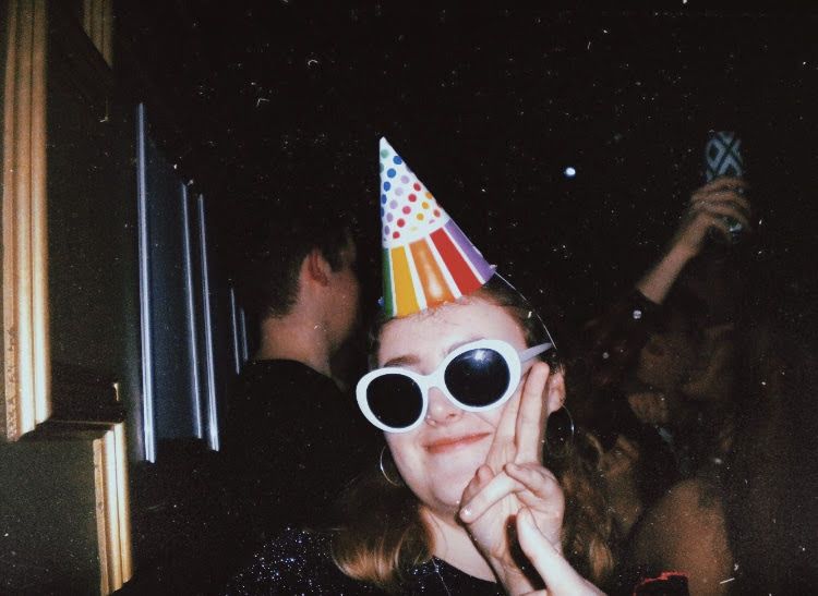 Image may contain: Human, Person, Hat, Party Hat, Accessories, Accessory, Sunglasses, Apparel, Clothing