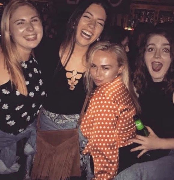 Image may contain: Night Life, People, Photo, Portrait, Photography, Pub, Bar Counter, Girl, Laughing, Night Club, Woman, Dress, Club, Party, Smile, Female, Apparel, Clothing, Face, Human, Person