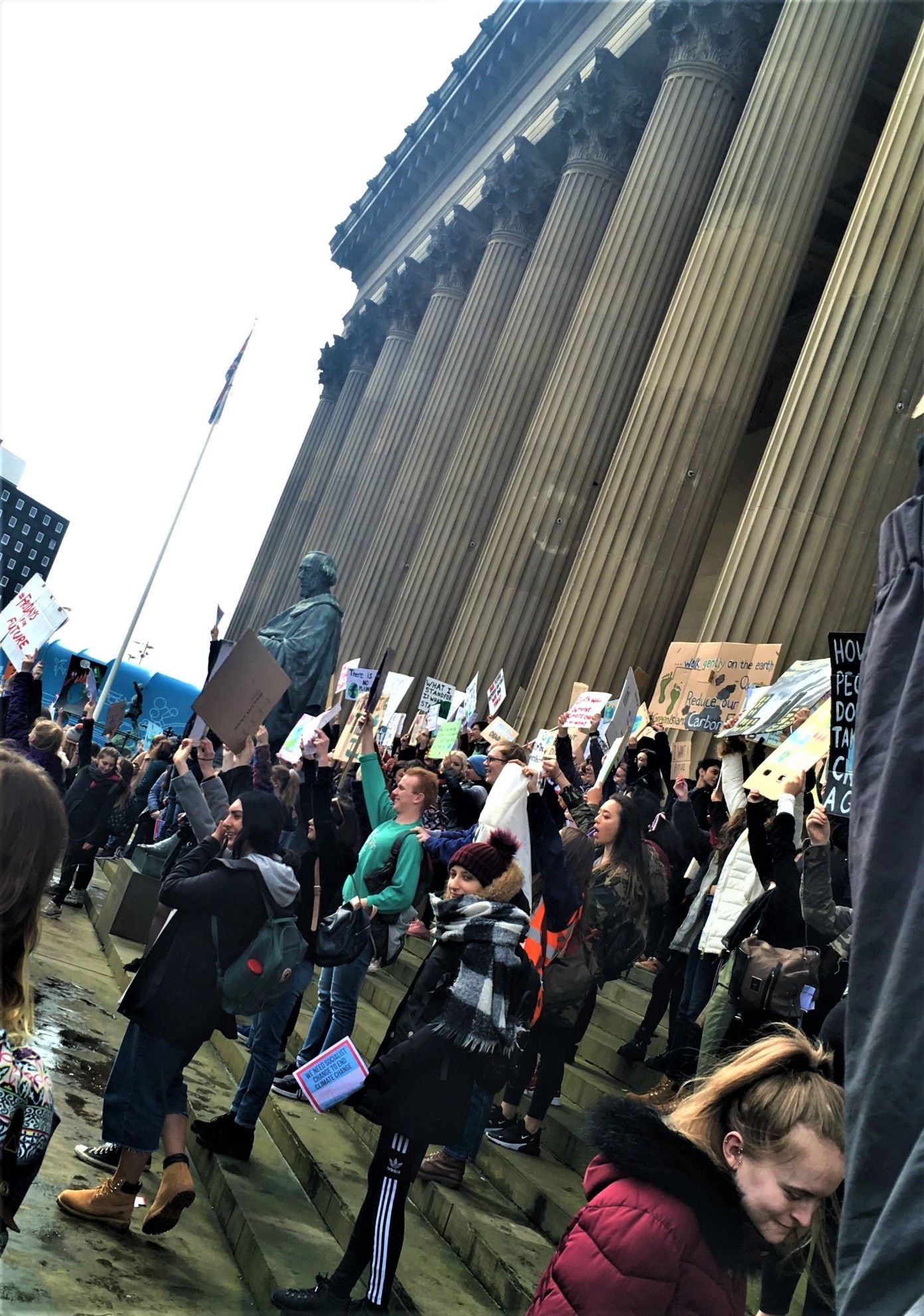 Image may contain: Pedestrian, Text, People, Shoe, Footwear, Apparel, Clothing, Crowd, Person, Human