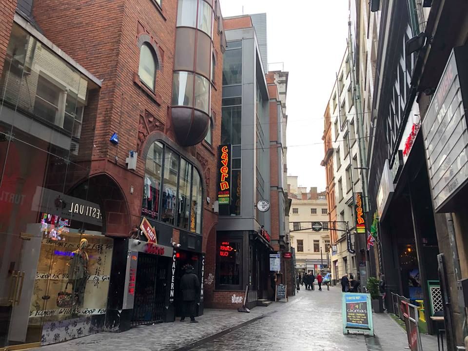 Image may contain: Downtown, Metropolis, Neighborhood, Sidewalk, Pavement, Alley, Alleyway, Person, Human, Path, Walkway, Town, Building, Urban, Street, Road, City