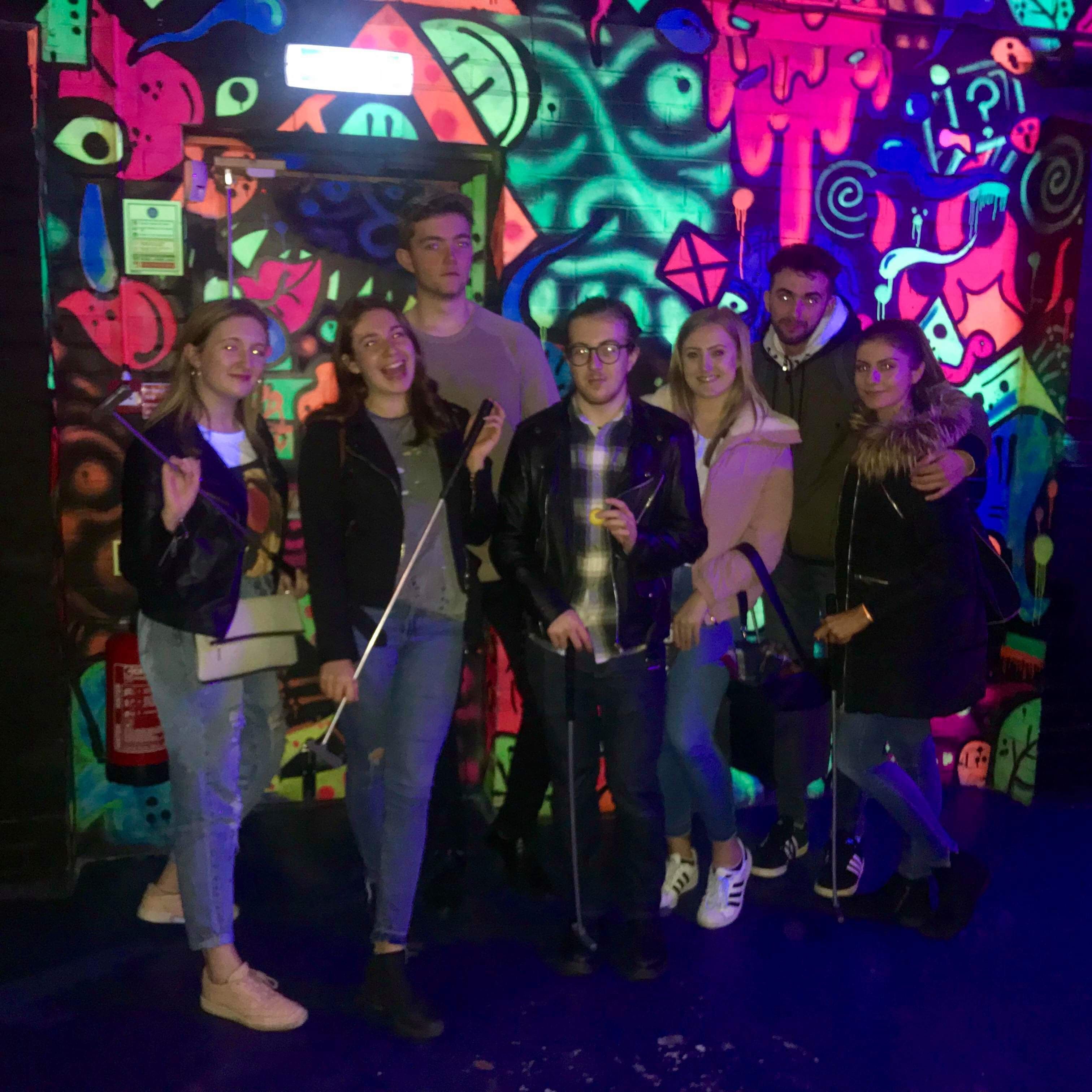 Image may contain: Night Life, Light, Apparel, Footwear, Shoe, Clothing, Night Club, Club, Person, Human