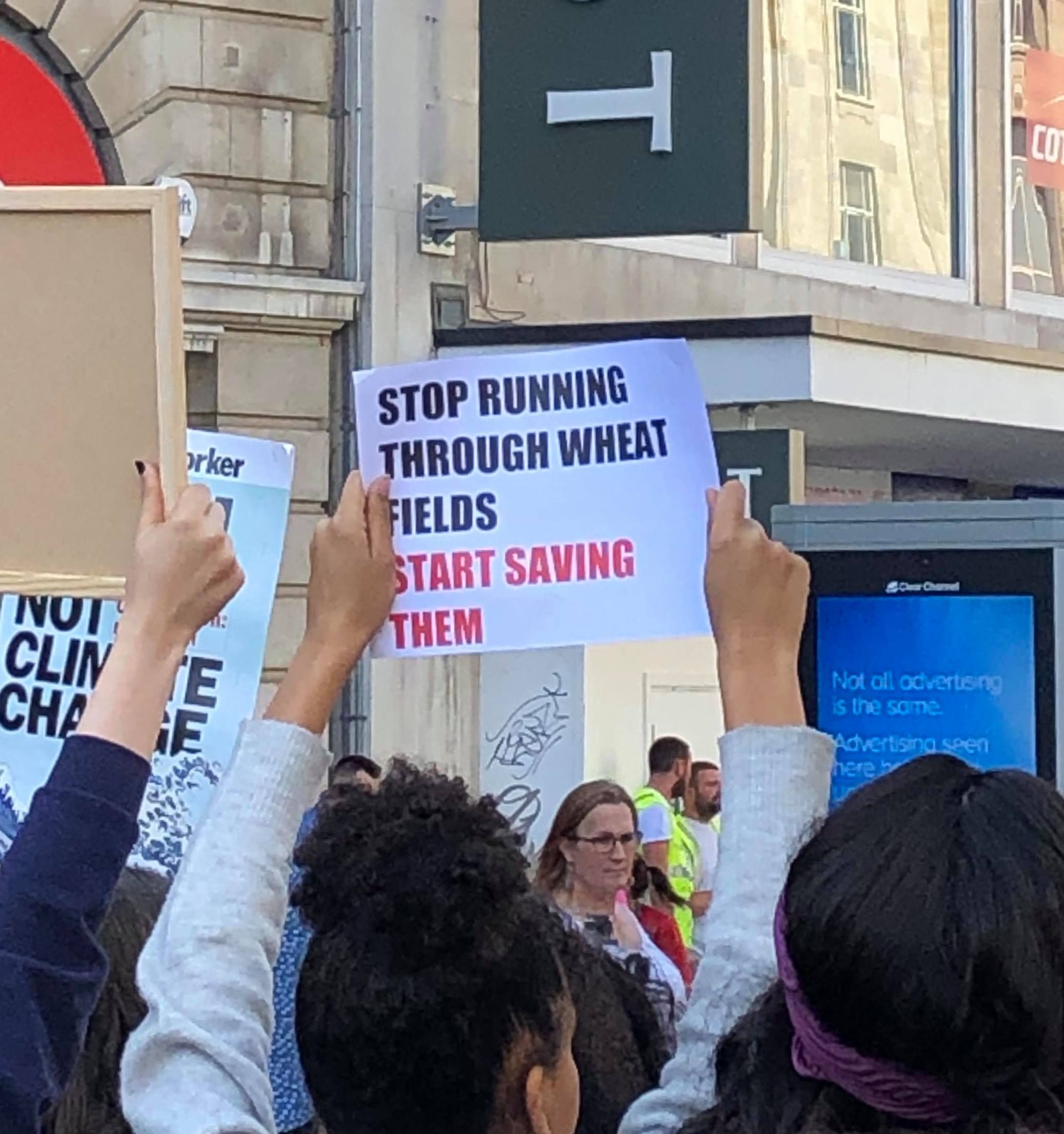 Image may contain: Parade, Crowd, Text, Person, Human