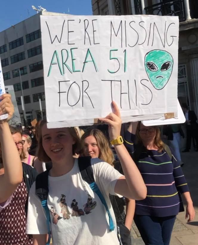 Image may contain: People, Face, Word, Banner, Crowd, Protest, Parade, Text, Human, Person