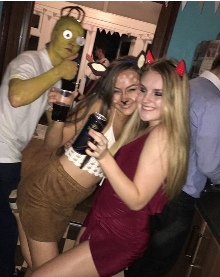 Image may contain: Face, Alcohol, Costume, Party, Female, Drink, Beverage, Apparel, Clothing, Pub, Bar Counter, Human, Person