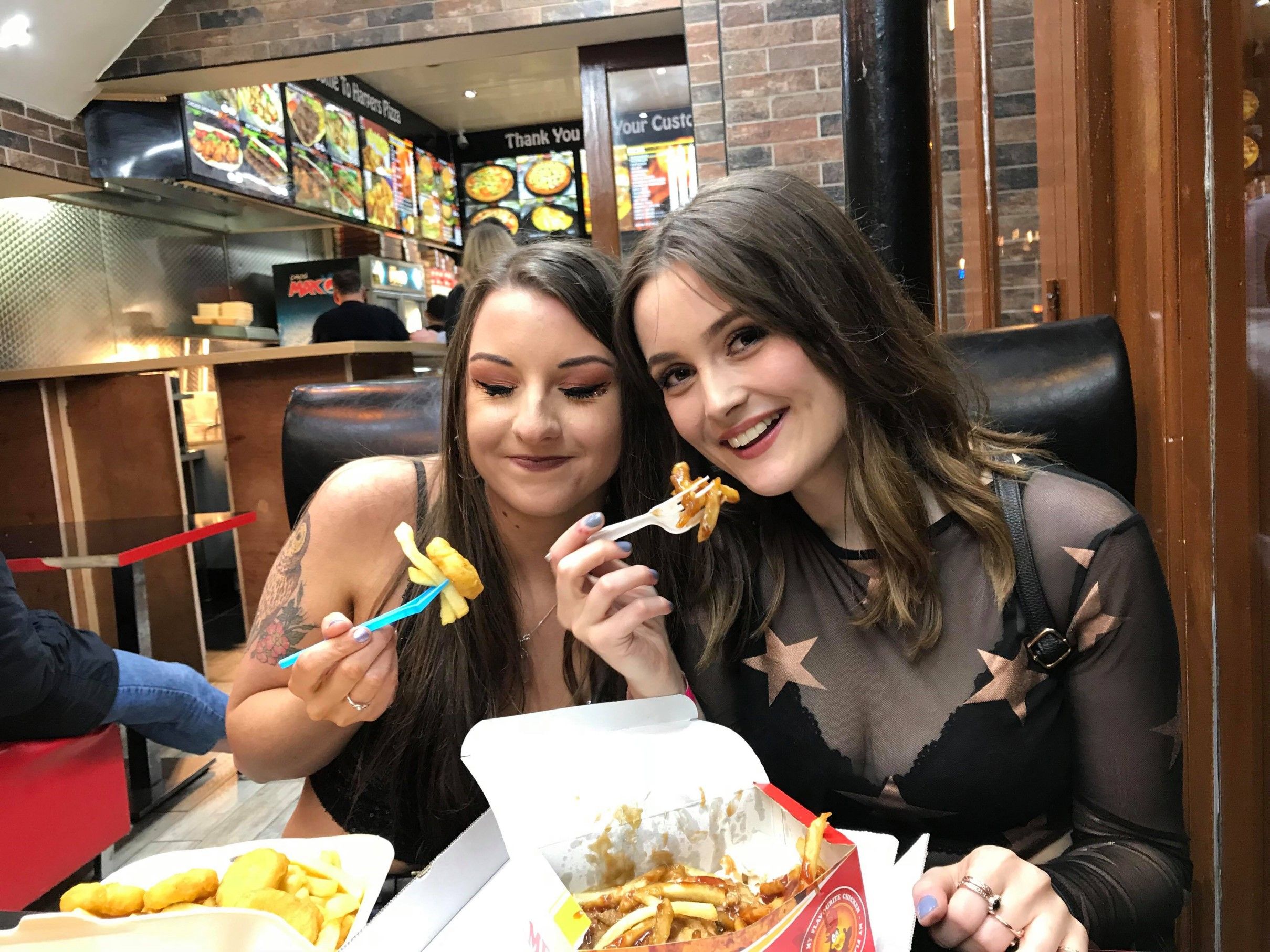Image may contain: Food Court, Meal, Dessert, Birthday Cake, Cake, Eating, Restaurant, Food, Human, Person