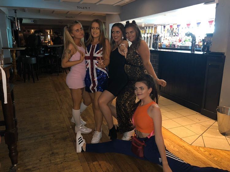 Image may contain: Girl, Table, Wood, Meal, Food, Restaurant, Shorts, Skirt, Face, Chair, Furniture, Woman, Shoe, Footwear, Bar Counter, Pub, Female, Person, Human, Apparel, Clothing