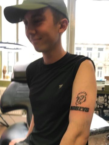 Image may contain: Man, Tattoo, Apparel, Clothing, Person, Human, Arm, Skin