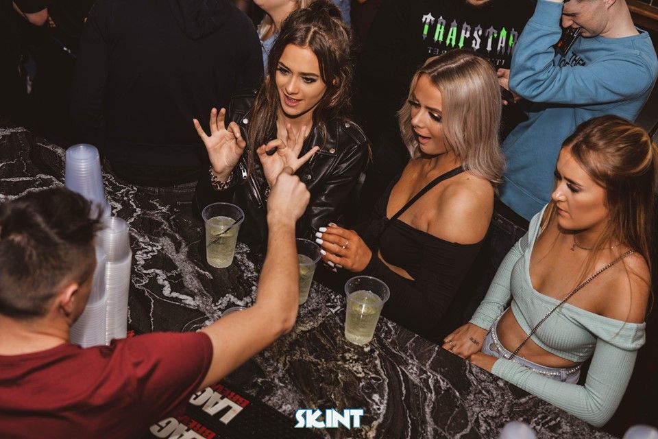 Image may contain: Night Club, Club, Alcohol, Bar Counter, Drink, Beverage, Pub, Party, Person, Human