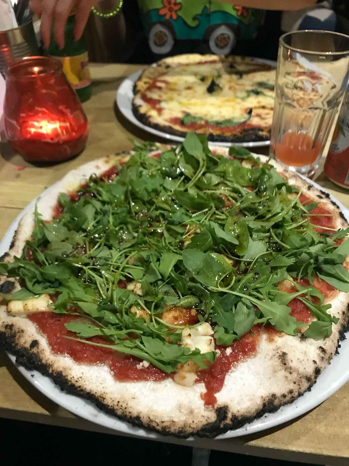 Image may contain: Arugula, Vegetable, Produce, Plant, Pizza, Food