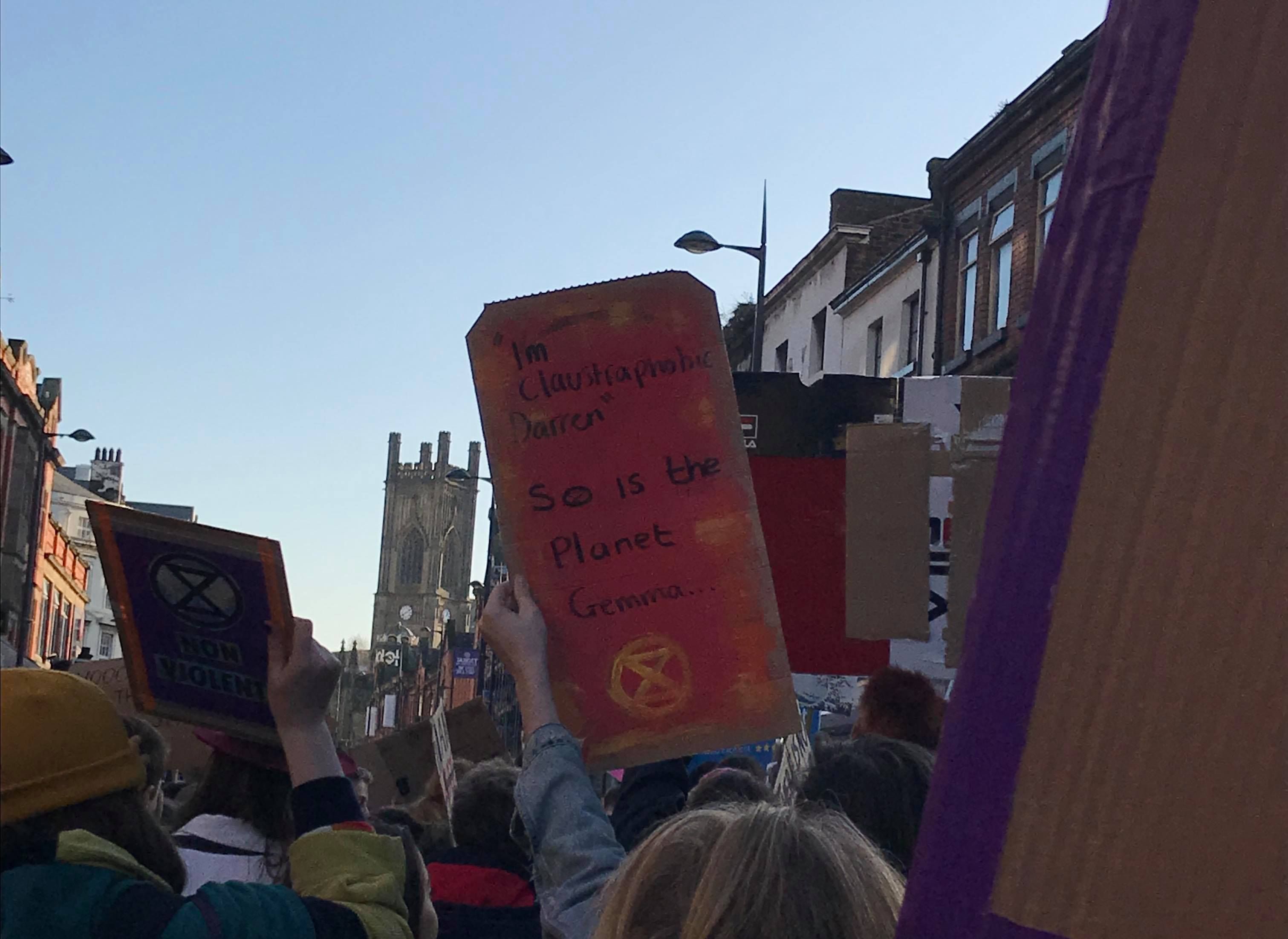 Image may contain: Banner, Crowd, Text, Human, Person