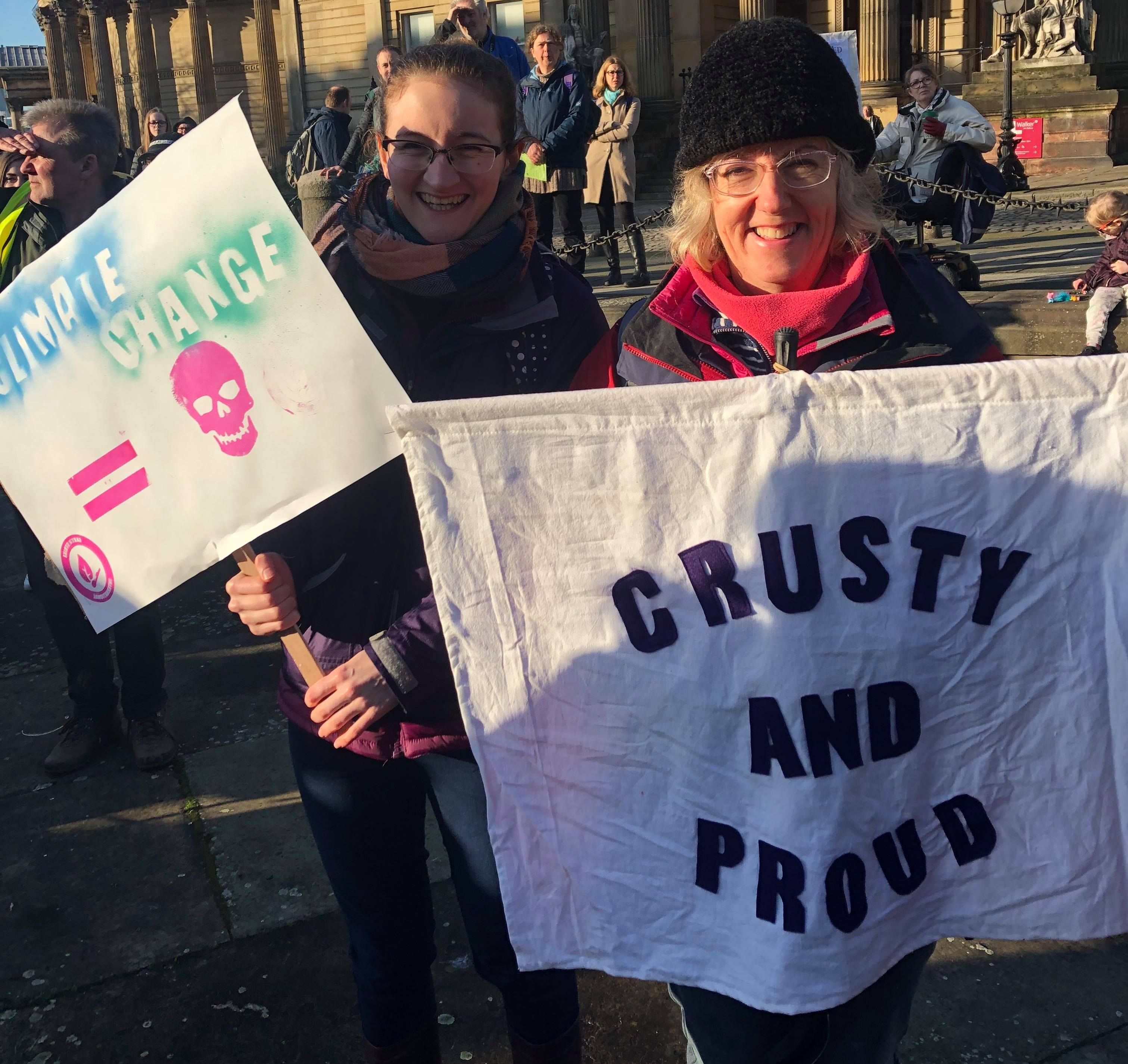 Image may contain: Crowd, Human, Person, Banner, Text