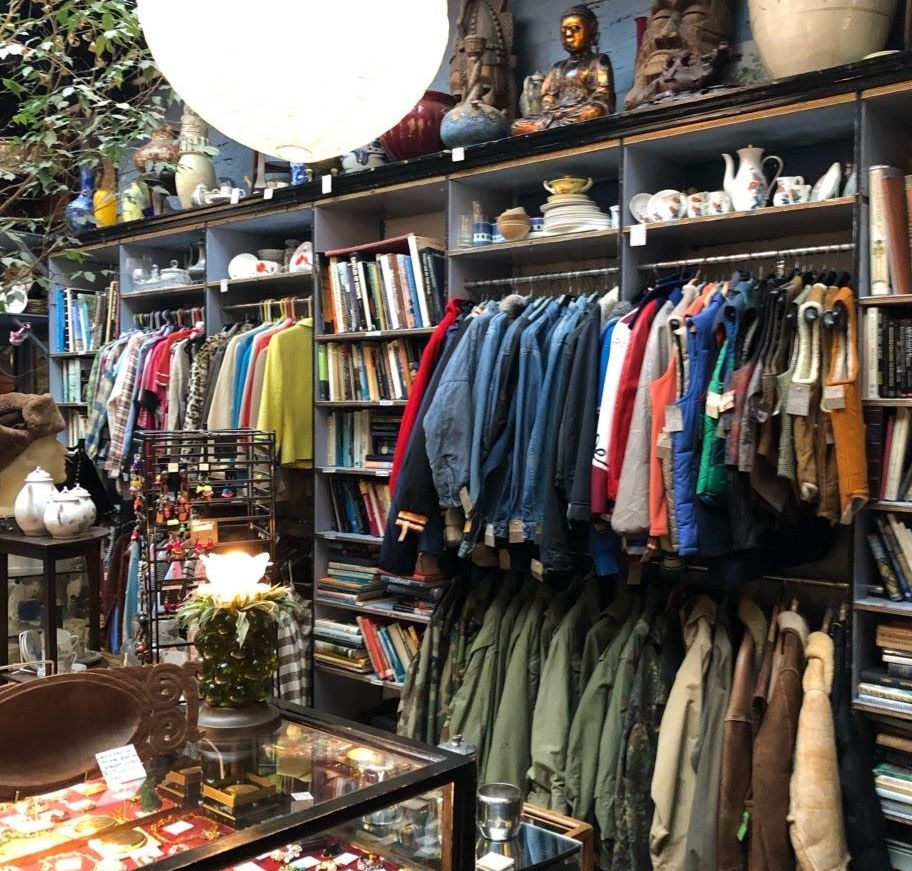 Image may contain: Interior Design, Room, Shelf, Boutique, Apparel, Clothing, Shop, Indoors, Furniture