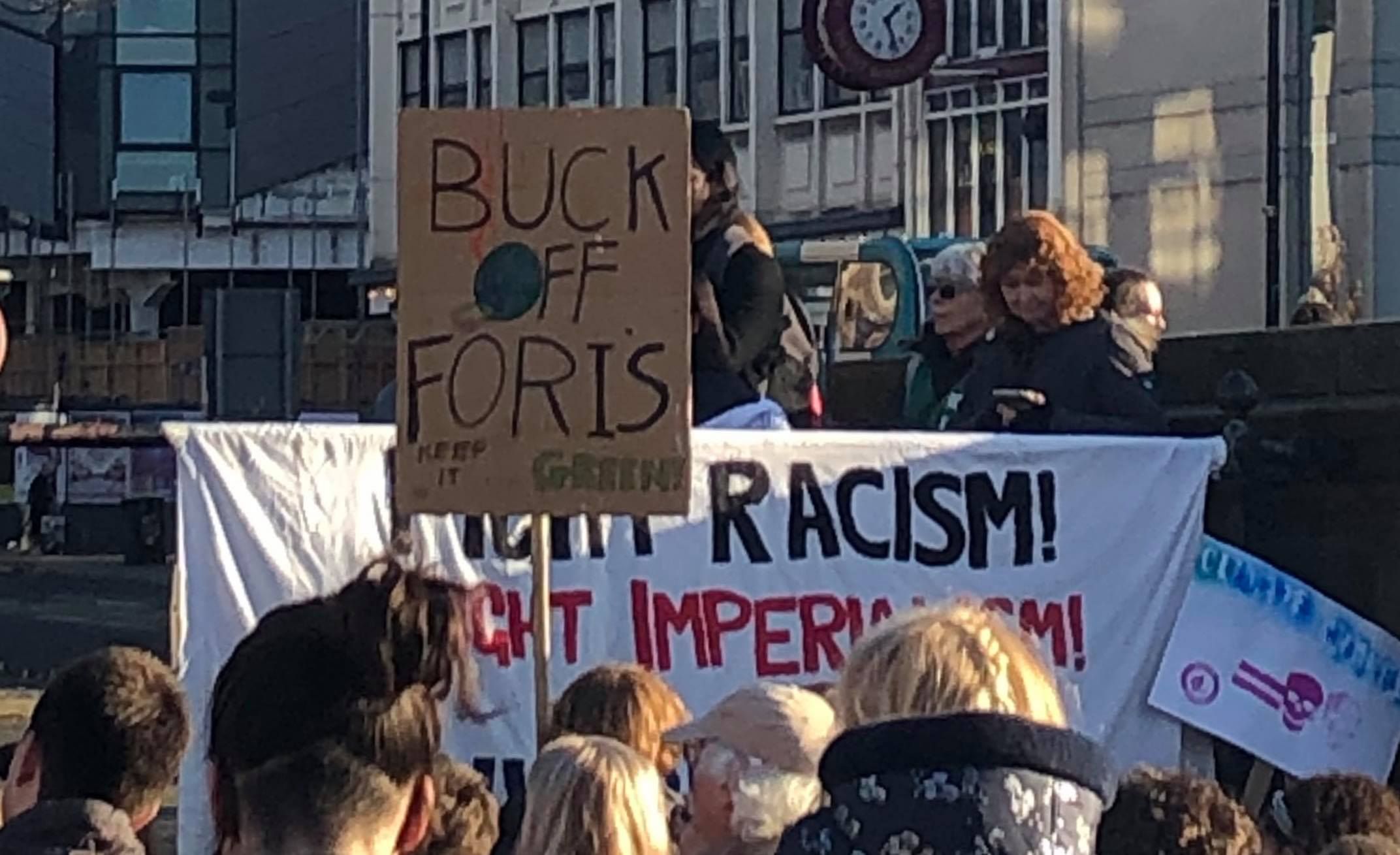 Image may contain: People, Banner, Word, Text, Crowd, Parade, Protest, Human, Person