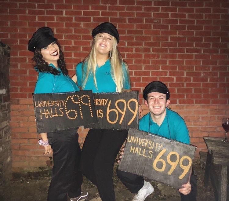 Image may contain: People, Plant, Girl, Outdoors, Cap, Photography, Portrait, Photo, Word, Hat, Smile, Costume, Female, Text, Denim, Jeans, Shoe, Footwear, Brick, Face, Human, Person, Pants, Apparel, Clothing