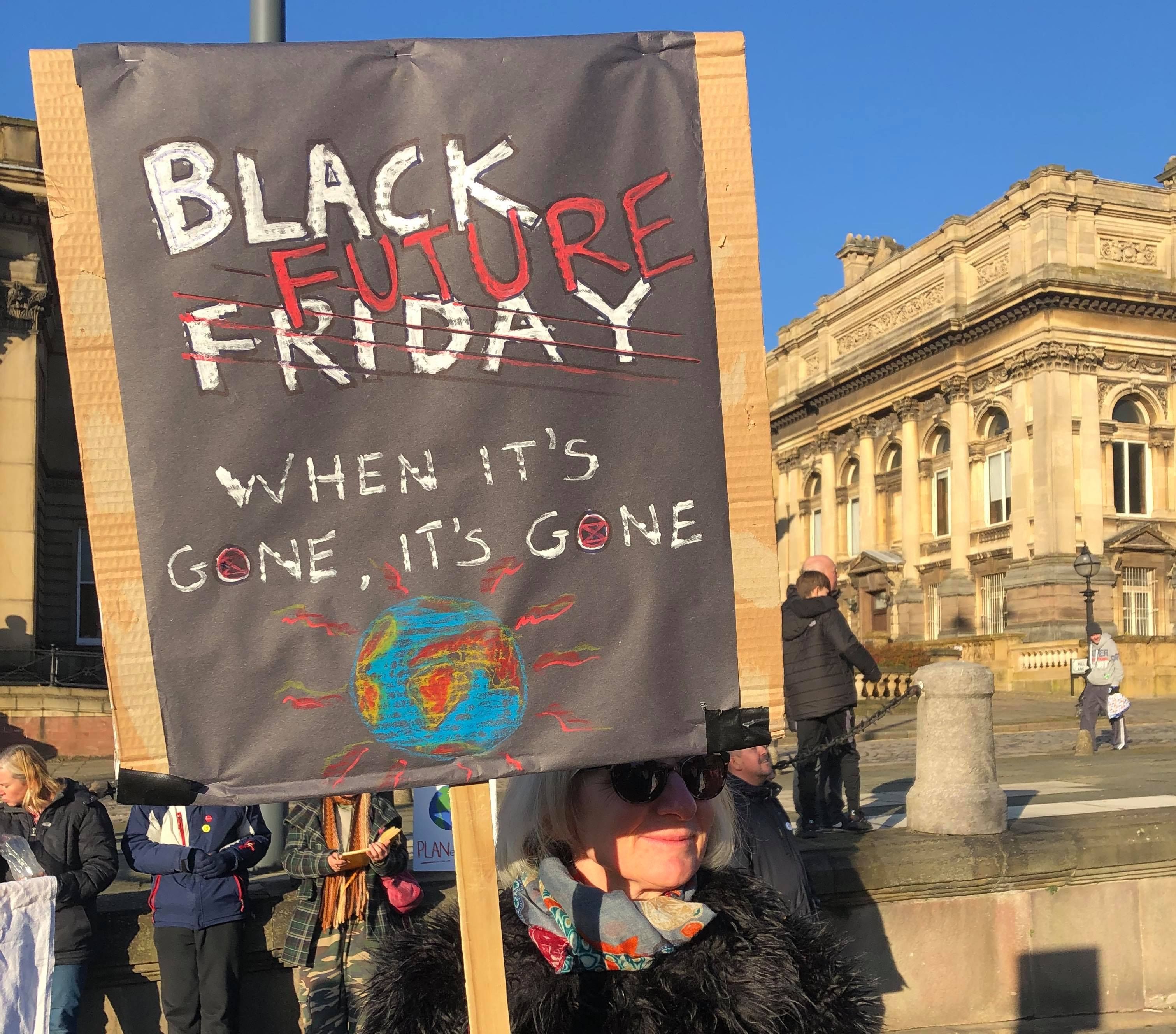 Image may contain: Urban, Accessories, Sunglasses, Accessory, Crowd, Banner, Text, Person, Human