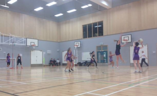UC centre bringing the ball into the attacking third.