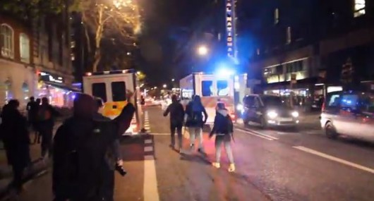 Last laugh... student flips the bird as the 5-0 flee the scene