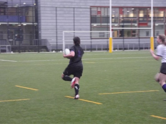 Eleanor sprinting down the pitch during International Tour to Amsterdam.