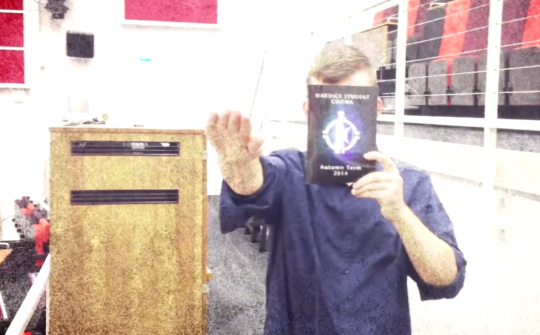 NA Man Seig Heils In A Lecture Theater, Holding A Warwick Student Booklet