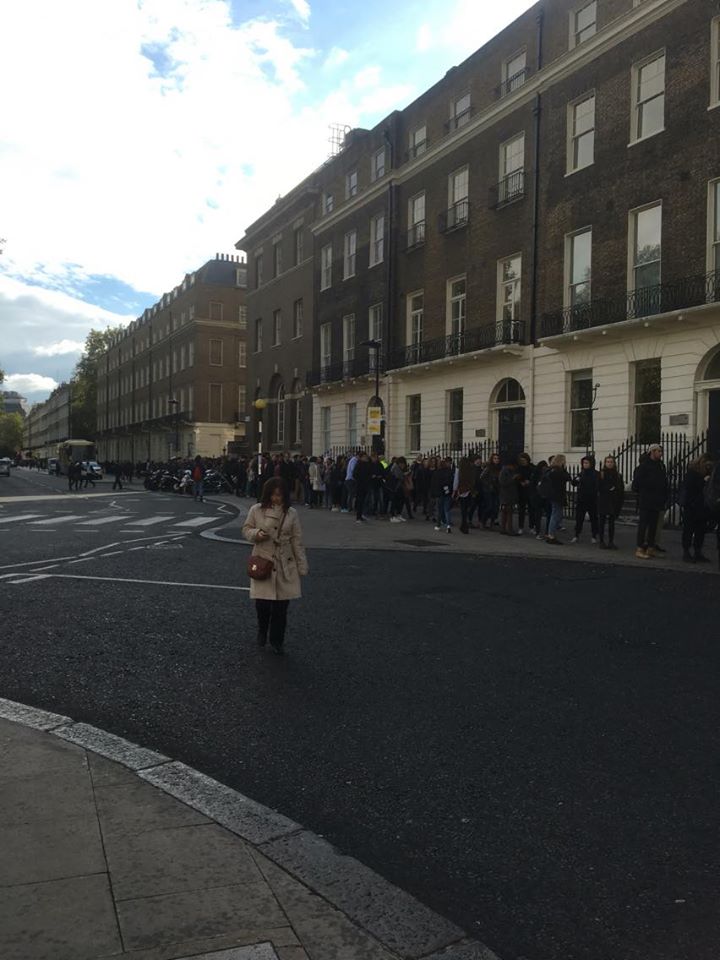 The queue is currently next to a main road