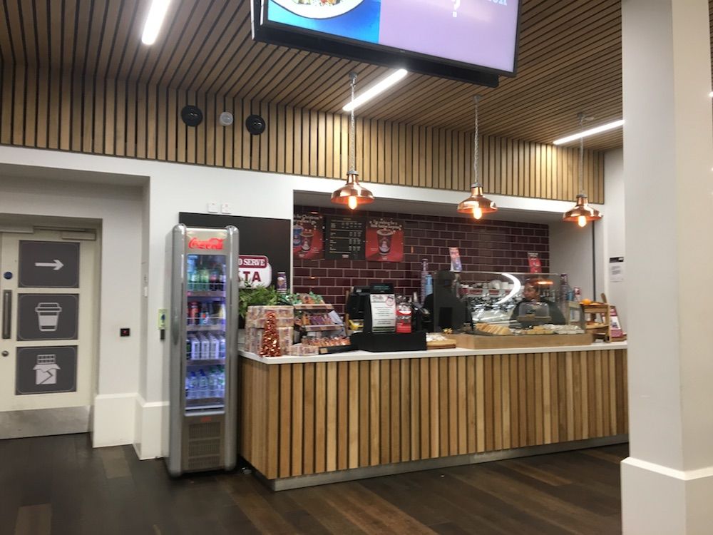 Image may contain: Kiosk, Indoors, Interior Design, Cafe, Appliance, Refrigerator, Wood, Cafeteria, Restaurant