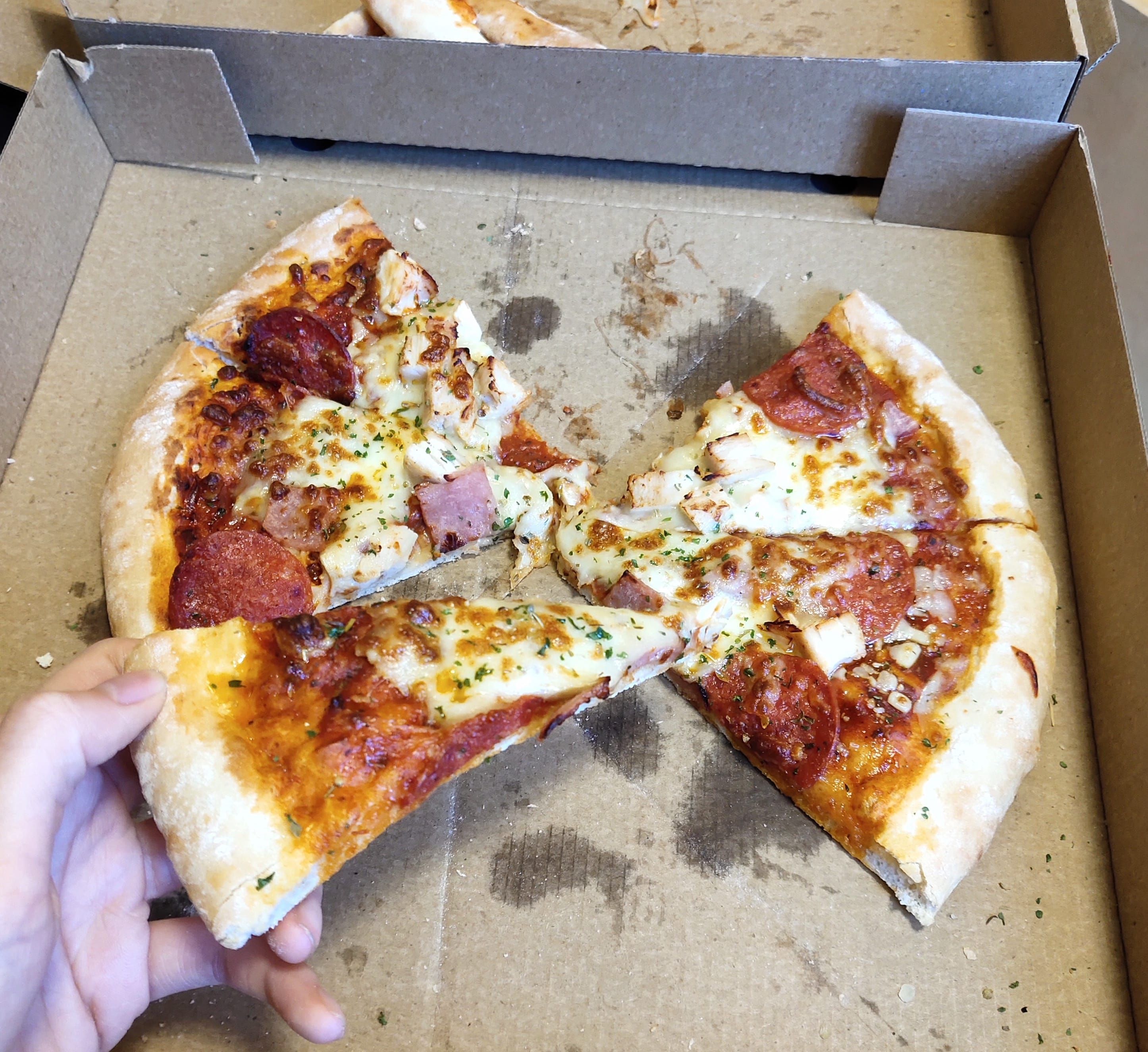 Image may contain: Person, Human, Food, Pizza