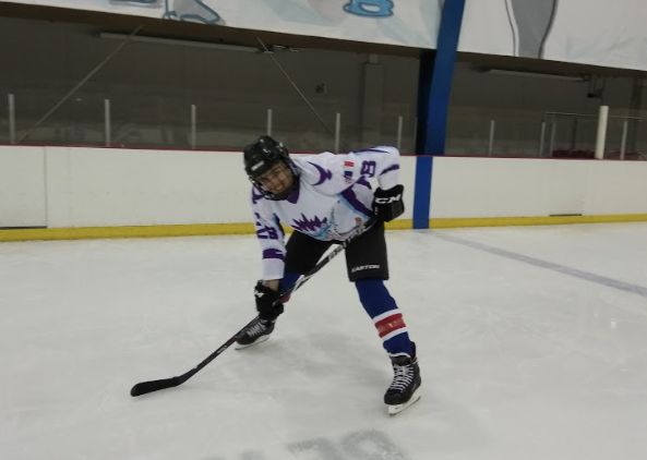 Image may contain: Apparel, Helmet, Clothing, Hockey, Ice Hockey, Team, Team Sport, Skating, Rink, Ice Skating, Sport, Sports, People, Human, Person