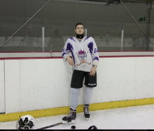 Image may contain: People, Team, Ice Hockey, Team Sport, Ice Skating, Rink, Sport, Skating, Human, Person, Sports