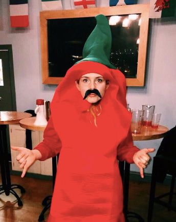 Image may contain: Hood, Sweatshirt, Sweater, Cape, Costume, Interior Design, Indoors, Human, Person, Chair, Furniture, Clothing, Apparel
