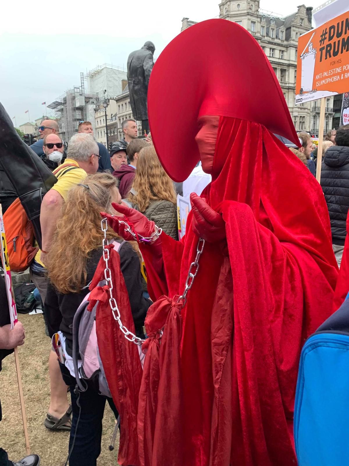 Image may contain: People, Costume, Apparel, Clothing, Festival, Person, Crowd, Human