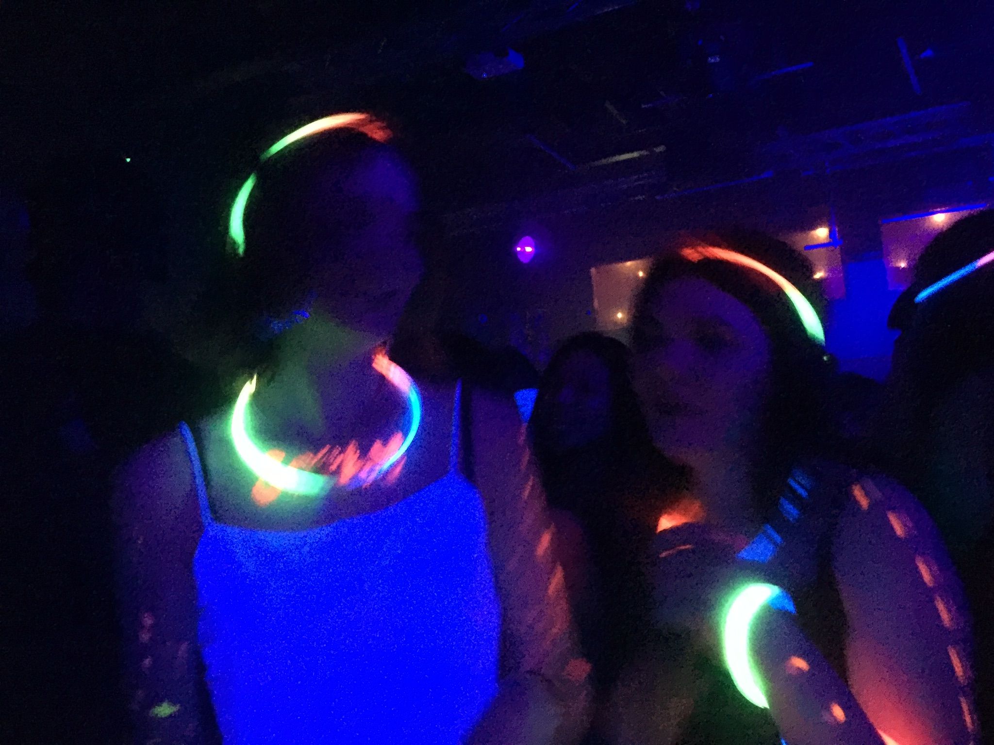 Image may contain: Night Life, Night Club, Club, Laser, Light, Human, Person