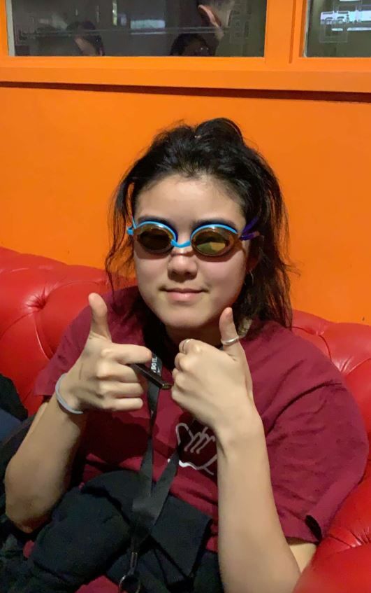 Image may contain: Female, Face, Goggles, Glasses, Thumbs Up, Finger, Human, Person, Accessory, Sunglasses, Accessories