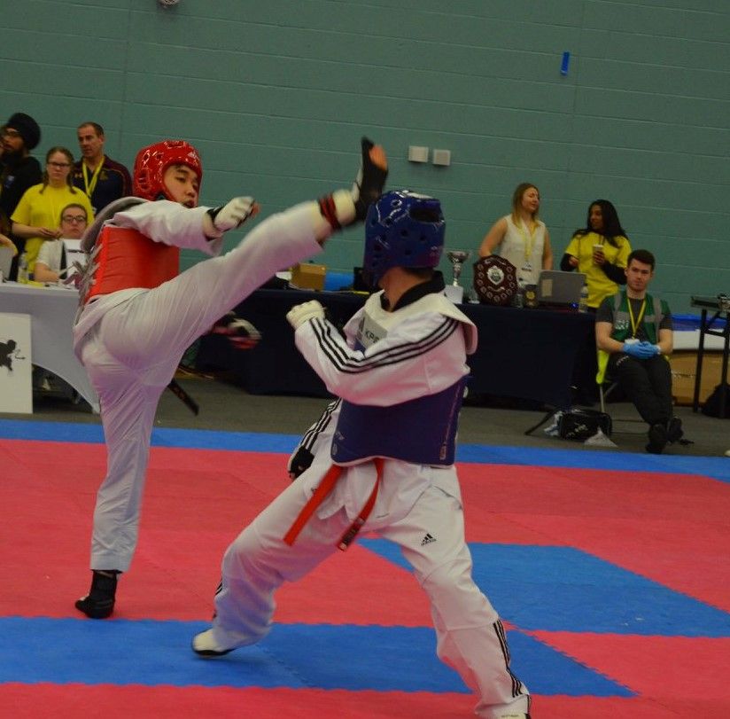 Image may contain: Flooring, Karate, Footwear, Shoe, Judo, Sports, Martial Arts, Sport, Apparel, Clothing, Helmet, Human, Person