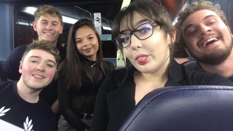Five people in a bus on the way to the club
